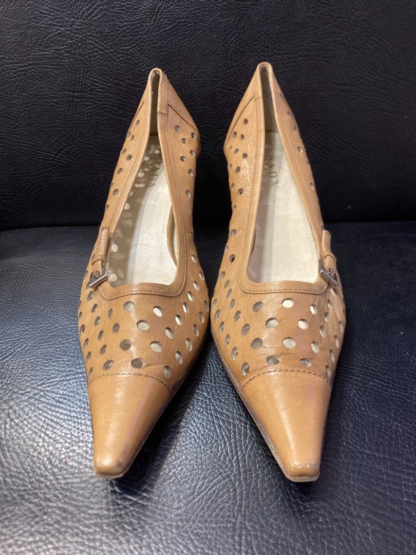 Prada Laser Cut Sandals (Category: Heels) located in Quezon City. Submitted by janisu0303 (Listing ID 1465492262, Image 2). Description: Prada Leather Lasercut Accents Pumps Size 35 8500 php 8/10 condition characterized by their tan pointed-toe design and distinct all-over perforated cut-out detailing with a small side buckle closure Prada Gucci Fendi Chanel Miu Miu balenciaga.