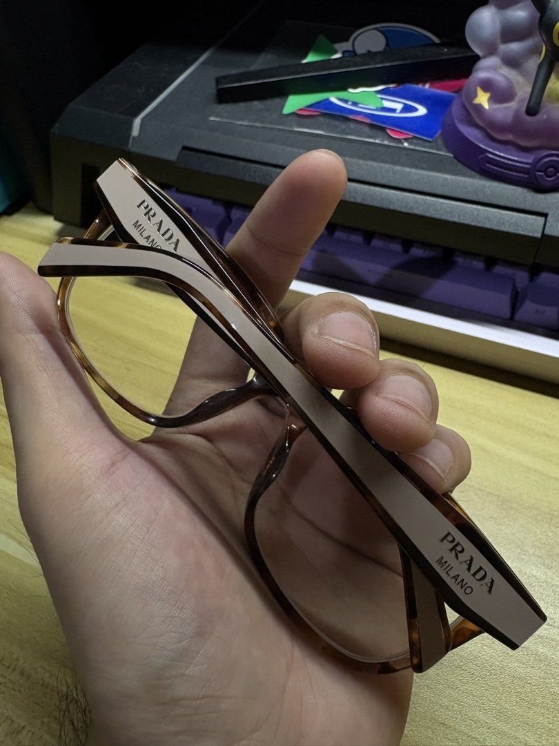 Prada VPR 17Z-F Eyeglass Frames (Category: Sunglasses & Eyewear) located in Manila. Submitted by tabucovhon79603 (Listing ID 1465464504, Image 1). Description: - Brand: Prada - Model: VPR 17Z-F (55□17 140) - Color: Classic tortoiseshell brown with contrasting cream temples - Design: Bold thick frames with prominent Prada Milano branding and integrated nose pads - Origin: Made in Italy - Condition: Great designer frames, ready for your custom pres