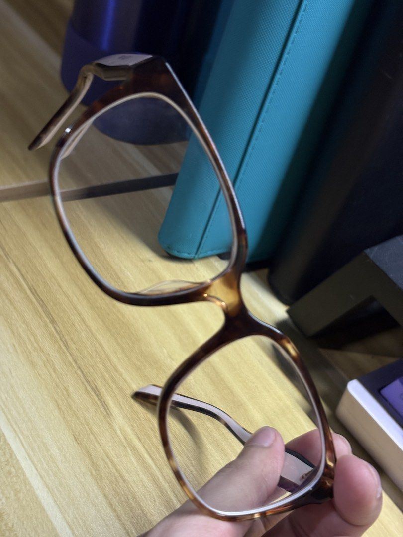 Prada VPR 17Z-F Eyeglass Frames (Category: Sunglasses & Eyewear) located in Manila. Submitted by tabucovhon79603 (Listing ID 1465464504, Image 3). Description: - Brand: Prada - Model: VPR 17Z-F (55□17 140) - Color: Classic tortoiseshell brown with contrasting cream temples - Design: Bold thick frames with prominent Prada Milano branding and integrated nose pads - Origin: Made in Italy - Condition: Great designer frames, ready for your custom pres