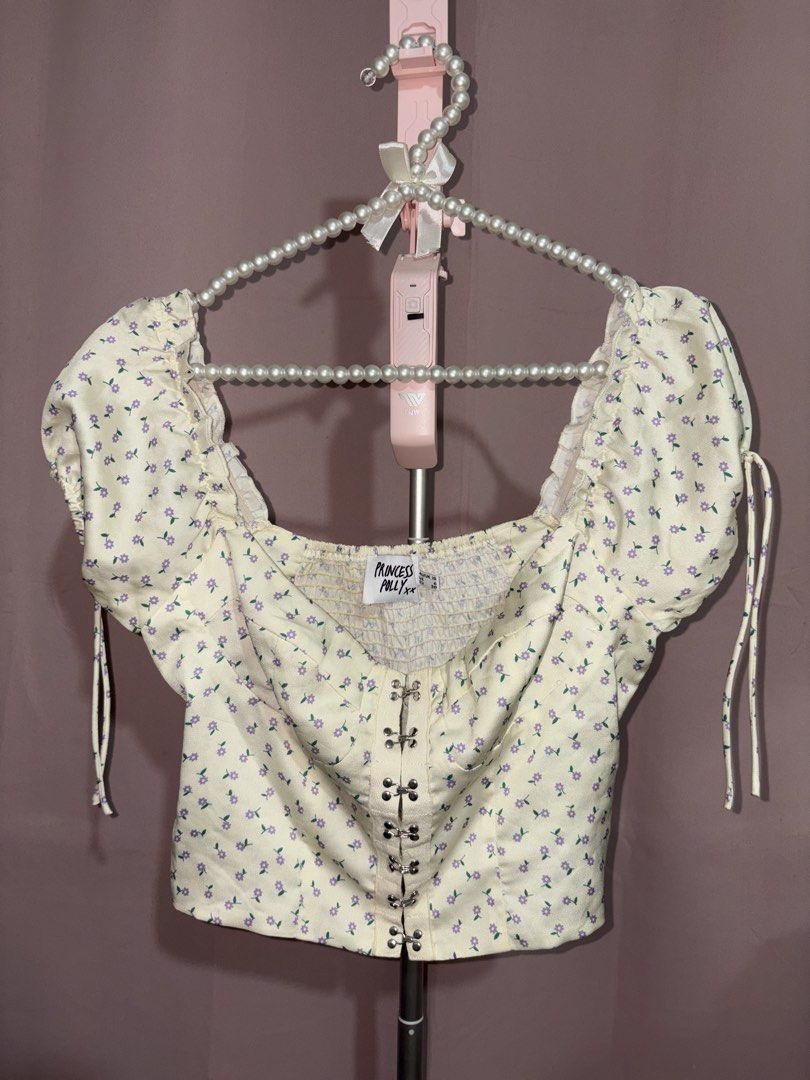 Princess Polly Floral Crop Top (Category: Sleeveless) located in Lapu Lapu. Submitted by cecillia07 (Listing ID 1465418662, Image 2). Description: Princess Polly yellow crop top with purple flower print all over. .