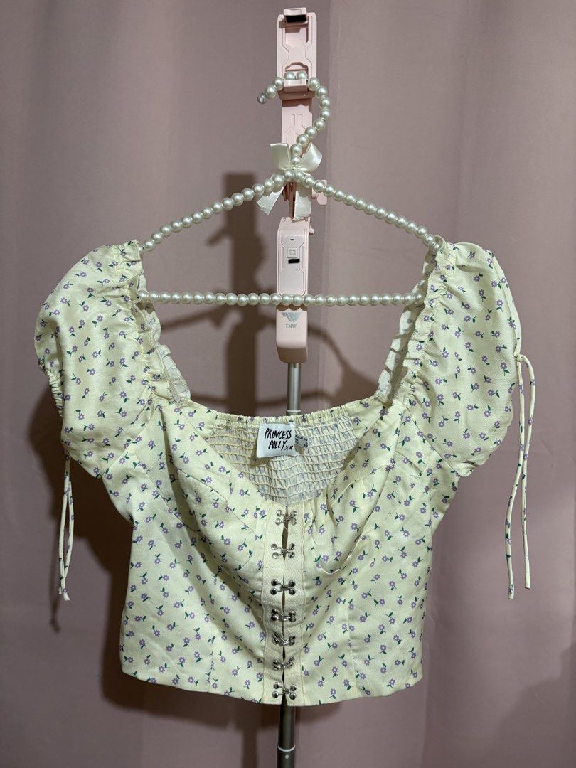 Princess Polly Floral Crop Top (Category: Sleeveless) located in Lapu Lapu. Submitted by cecillia07 (Listing ID 1465418662, Image 1). Description: Princess Polly yellow crop top with purple flower print all over. .