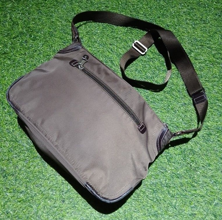 Progrès Crossbody Bag Brown Nylon (Category: Cross-body Bags) located in Manila. Submitted by patrickjos06722 (Listing ID 1465510378, Image 2). Description: - Brand: Progrès - Material: Durable brown nylon with stylish leather-style trim - Design: Compact everyday crossbody and shoulder bag - Strap: Adjustable for a custom, comfortable fit - Pockets: Secure top zipper closure, exterior back zip pocket, and multiple interior storage compartments -