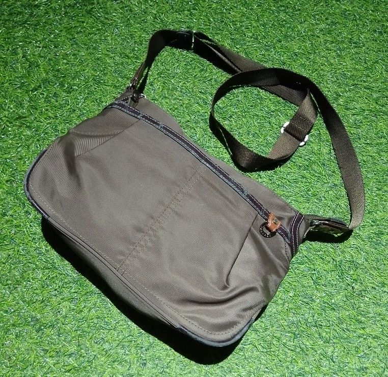 Progrès Crossbody Bag Brown Nylon (Category: Cross-body Bags) located in Manila. Submitted by patrickjos06722 (Listing ID 1465510378, Image 1). Description: - Brand: Progrès - Material: Durable brown nylon with stylish leather-style trim - Design: Compact everyday crossbody and shoulder bag - Strap: Adjustable for a custom, comfortable fit - Pockets: Secure top zipper closure, exterior back zip pocket, and multiple interior storage compartments -