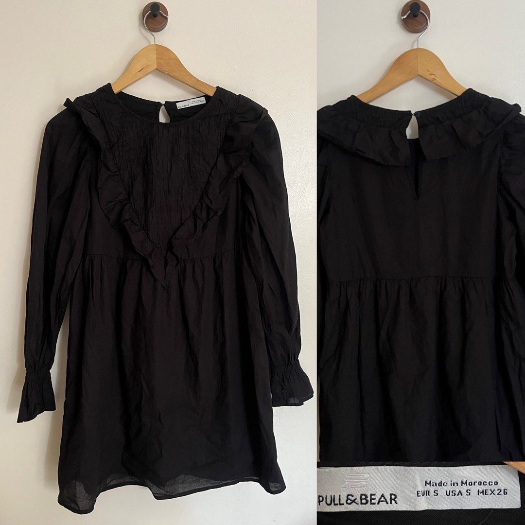 Pull & Bear Black Ruffle Smocked Long Sleeve Dress (Category: Dresses) located in General Santos City (Dadiangas). Submitted by dresswithaly (Listing ID 1465402070, Image 1). Description: - Brand: Pull & Bear - Style: Long sleeve baby doll dress with flared cut - Size: S (Made in Morocco) - Color: Black - Details: Smocked front panel, ruffled trims on shoulders and neckline, keyhole button closure at the back - Material: Lightweight fabric - Cond