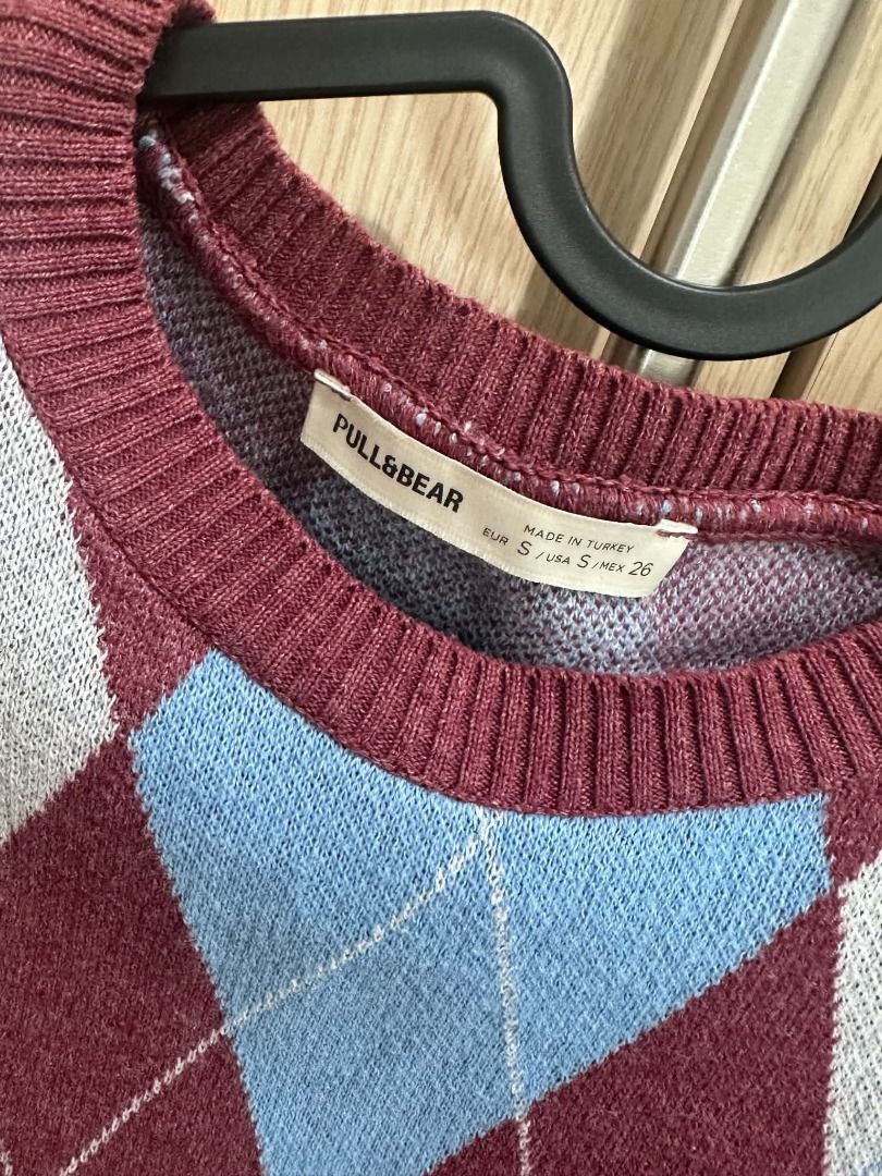 Pull & Bear Knit Sweater Vest - Maroon Blue Size US Small (Category: Vests) located in Manila. Submitted by Joymee (Listing ID 1465405096, Image 3). Description: via Lalamove/Grab delivery only - Color: Maroon with light blue and grey argyle pattern - Style: Classic crew neck sweater vest with ribbed detailing - Material: Lightweight wool blend - Condition: Excellent, clean with no flaws - Versatility: Great for layering over shirts or wearing so