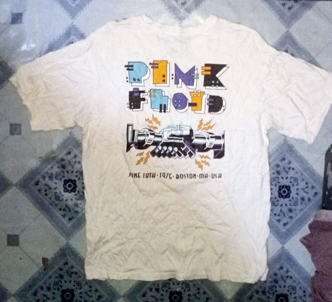 Pull & Bear Pink Floyd 1976 Tour T-Shirt (Category: Tshirts & Polo Shirts ) located in Zamboanga. Submitted by mlalahura32300 (Listing ID 1465500965, Image 2). Description: - Brand: Pull & Bear - Design: Pink Floyd 'Wish You Were Here' handshake print on front and back with June 10th 1976 Boston MA USA text - Color: White - Size: S (Casual oversized fit) - Material: Standard cotton (Made in Turkey) - Style: Short sleeves, crew neck - Condition: E