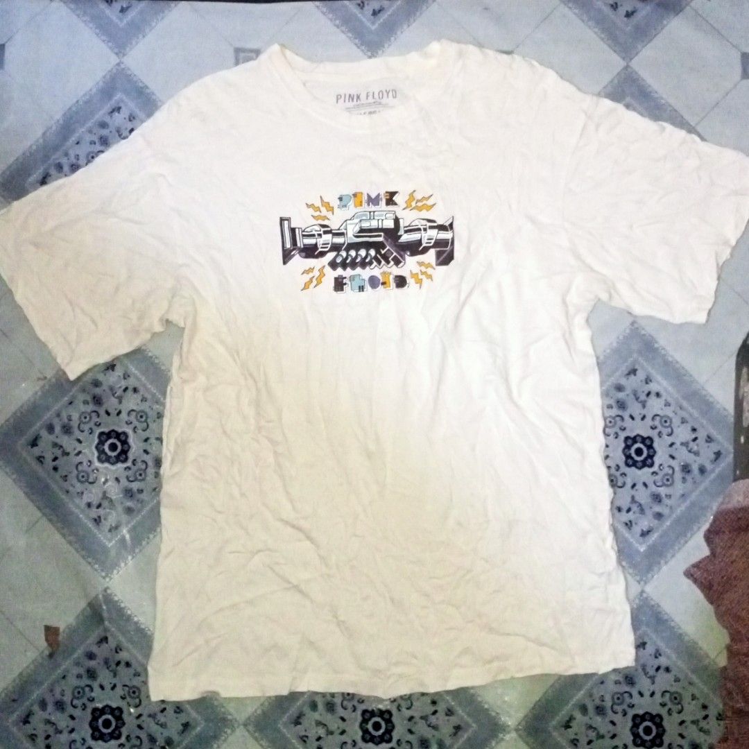 Pull & Bear Pink Floyd 1976 Tour T-Shirt (Category: Tshirts & Polo Shirts ) located in Zamboanga. Submitted by mlalahura32300 (Listing ID 1465500965, Image 1). Description: - Brand: Pull & Bear - Design: Pink Floyd 'Wish You Were Here' handshake print on front and back with June 10th 1976 Boston MA USA text - Color: White - Size: S (Casual oversized fit) - Material: Standard cotton (Made in Turkey) - Style: Short sleeves, crew neck - Condition: E