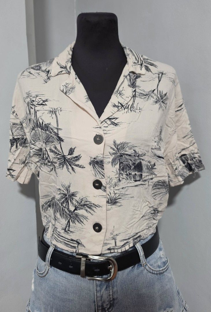 Pull & Bear Tropical Print Short Sleeve crop PoLo small (Category: Shirts) located in Paranaque City. Submitted by franinnashop (Listing ID 1465441488, Image 1). Description: DECLUTTER SMALL TO MED PARANAQUE CITY - Brand: Pull & Bear - Style: Camp collar blouse with front button closure (3 dark buttons) - Design: Cream background with black tropical palm tree and beach sketch print - Size: S - Material: Light, breathable fabric, ideal for warm we