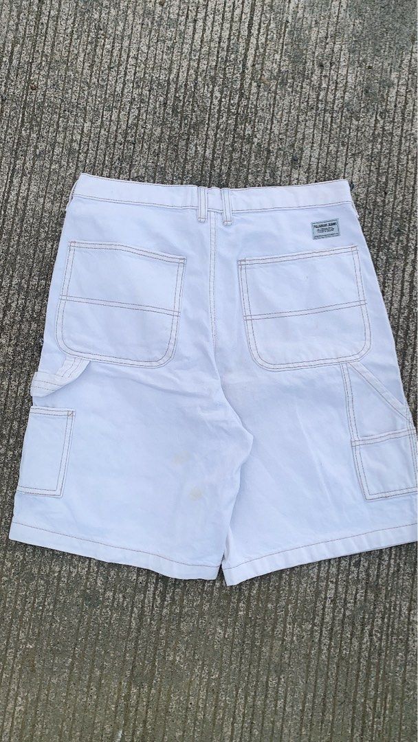 Pull & Bear White Denim Cargo Shorts (Category: Shorts) located in Iloilo. Submitted by johnpullan30303 (Listing ID 1465494109, Image 1). Description: - Brand: Pull & Bear - Color: White - Material: Sturdy denim - Features: Multiple side utility pockets, back pockets with contrast stitching, button fly closure - Style: Casual streetwear staple - Condition: Good, with some minor stains on the lower front leg.