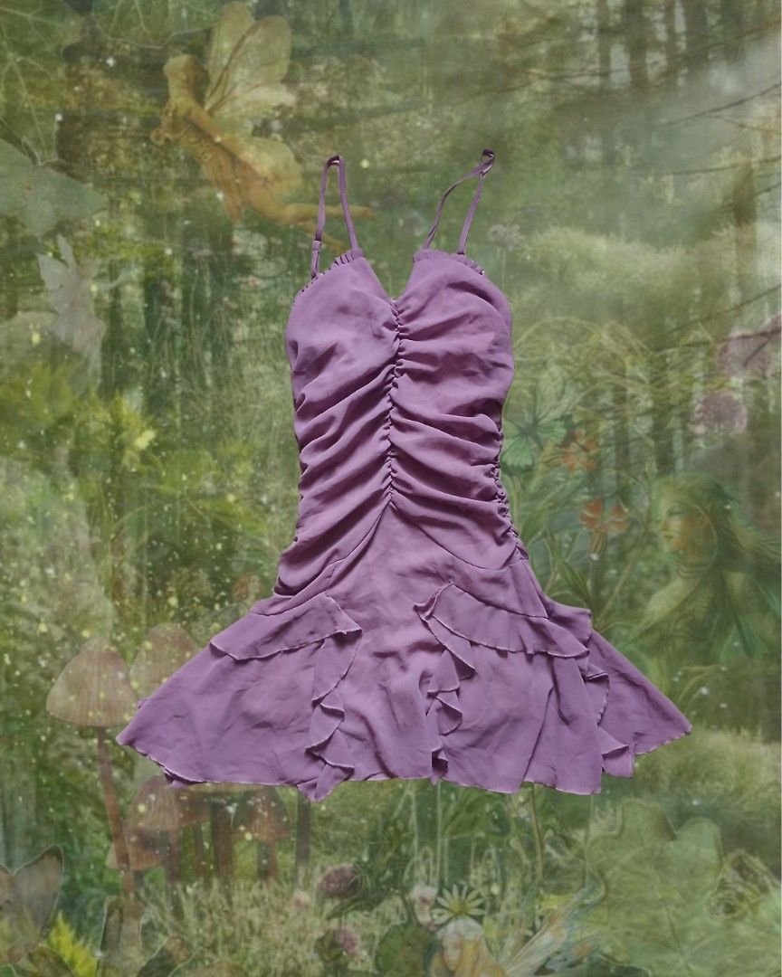 Purple Ruched Mini Dress With Ruffle Hem (Category: Dresses) located in Antipolo. Submitted by mochisky (Listing ID 1465422372, Image 1). Description: - Color: Purple - Style: Mini dress with fully ruched front and layered ruffled hem - Straps: Adjustable spaghetti straps - Material: Lightweight chiffon-like fabric.