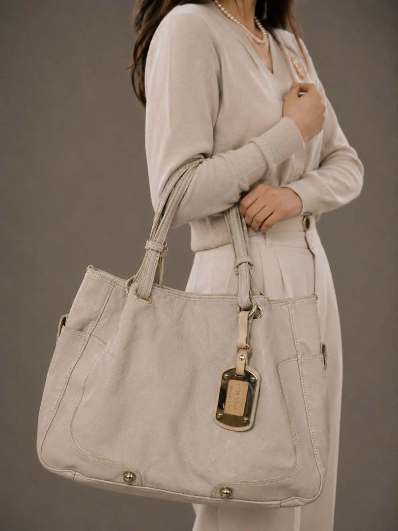 Queen's Tiara Pebbled—Shoulder Tote Bag (Category: Shoulder Bags) located in Baguio. Submitted by luxuryvaultbagsandfashion (Listing ID 1465477184, Image 1). Description: ✨👜Queen’s Tiara Cream Pebbled Shoulder Tote Bag👜✨ Crafted in a soft cream/beige tone with a textured pebbled finish, it effortlessly balances a relaxed silhouette with a polished, high-end look. Perfectly spacious and organized for daily use or office wear. Features & Specific