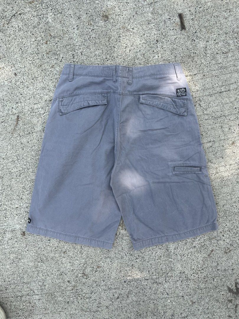 Quiksilver Grey Skate Shorts (Category: Shorts) located in Cebu City. Submitted by guttathreads (Listing ID 1465459056, Image 2). Description: - Brand: Quiksilver - Color: Grey - Style: Classic skate, relaxed fit - Features: Multiple utility pockets, belt loops - Details: Signature back pocket patch logo and embroidered mountain wave logo near the hem - Condition: Excellent pre-loved condition.