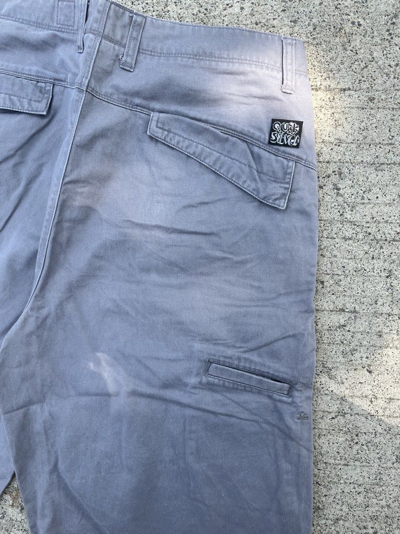 Quiksilver Grey Skate Shorts (Category: Shorts) located in Cebu City. Submitted by guttathreads (Listing ID 1465459056, Image 3). Description: - Brand: Quiksilver - Color: Grey - Style: Classic skate, relaxed fit - Features: Multiple utility pockets, belt loops - Details: Signature back pocket patch logo and embroidered mountain wave logo near the hem - Condition: Excellent pre-loved condition.
