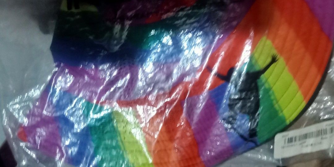 Rainbow Striped Bucket Hat (Category: Hats & Beanies) located in Paranaque City. Submitted by dimaguilaa94969 (Listing ID 1459546910, Image 2). Description: - Fun bucket hat with vibrant rainbow stripes - Ideal for festivals or adding a pop of color to any outfit pm of int 09260966619 - Wide brim provides excellent sun protection - Comfortable one-size-fits-most design - Made from durable nylon or polyester material.