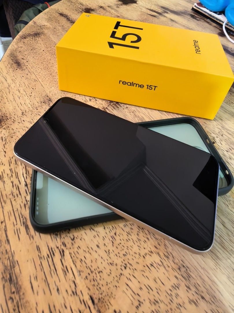 Realme 15t 512gb (Flowing Silver) (Category: Realme) located in Pasig City. Submitted by kyenramos (Listing ID 1465474481, Image 1). Description: Used for 8 months only. 2 very minor scratch/dent. Complete box and charger and with phone case. Battery is in very excellent condition. I usually charge after 1-2 days. RFS: Upgrade to a higher end phone. 📍 Pasig.