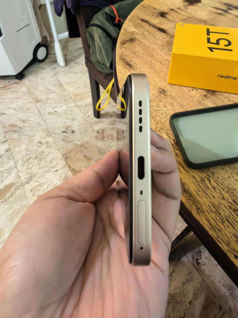 Realme 15t 512gb (Flowing Silver) (Category: Realme) located in Pasig City. Submitted by kyenramos (Listing ID 1465474481, Image 3). Description: Used for 8 months only. 2 very minor scratch/dent. Complete box and charger and with phone case. Battery is in very excellent condition. I usually charge after 1-2 days. RFS: Upgrade to a higher end phone. 📍 Pasig.