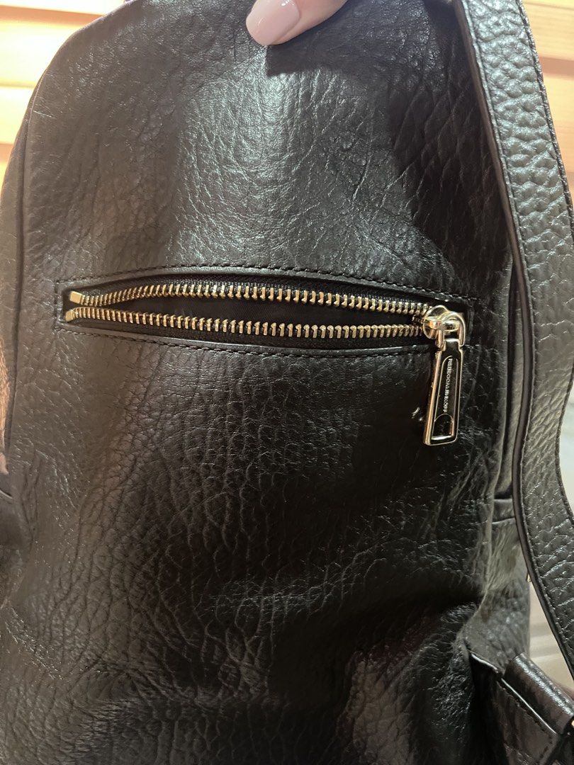 Rebecca Minkoff Black Leather (Category: Backpacks) located in Quezon City. Submitted by jinnysells (Listing ID 1465401535, Image 2). Description: - Brand: Rebecca Minkoff - Style: Julian Backpack - black pebble leather - Features: Zipper details on front and sides, exterior back zippered pocket - with extra suede string inside for the zipper pockets - Inclusion: Original dust bag included - price negotiable, no lowballing .