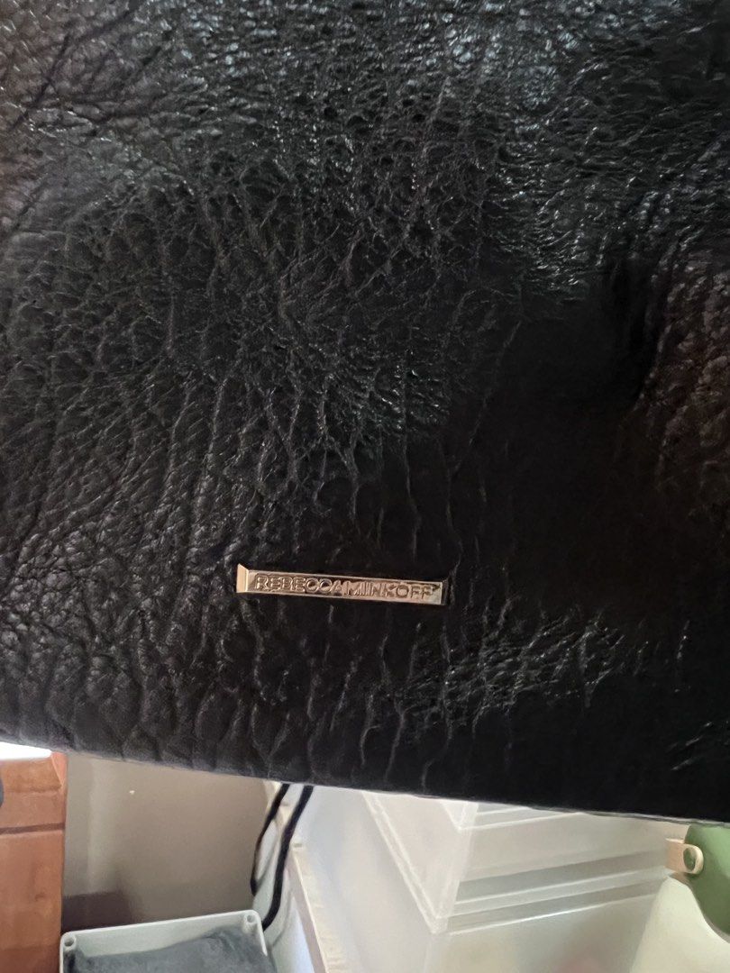 Rebecca Minkoff Black Leather (Category: Backpacks) located in Quezon City. Submitted by jinnysells (Listing ID 1465401535, Image 3). Description: - Brand: Rebecca Minkoff - Style: Julian Backpack - black pebble leather - Features: Zipper details on front and sides, exterior back zippered pocket - with extra suede string inside for the zipper pockets - Inclusion: Original dust bag included - price negotiable, no lowballing .
