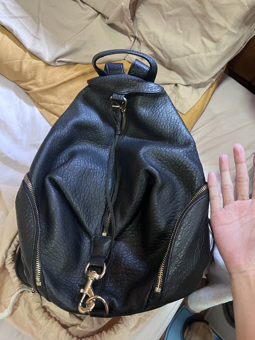 Rebecca Minkoff Black Leather (Category: Backpacks) located in Quezon City. Submitted by jinnysells (Listing ID 1465401535, Image 1). Description: - Brand: Rebecca Minkoff - Style: Julian Backpack - black pebble leather - Features: Zipper details on front and sides, exterior back zippered pocket - with extra suede string inside for the zipper pockets - Inclusion: Original dust bag included - price negotiable, no lowballing .