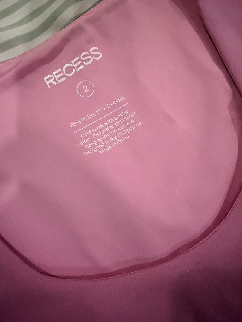 Recess Pink Athletic Crop Top Size 2 (Category: Activewear) located in Marikina City. Submitted by teacher.maria (Listing ID 1465390975, Image 2). Description: - Brand: Recess - Color: Pink - Style: Athletic crop top with short sleeves and scoop neckline - Size: Tagged size 2 - Material: 85% nylon, 15% spandex (stretchable and comfortable) - Origin: Designed in the Philippines, made in China - Care: Cold wash (instructions printed inside collar).