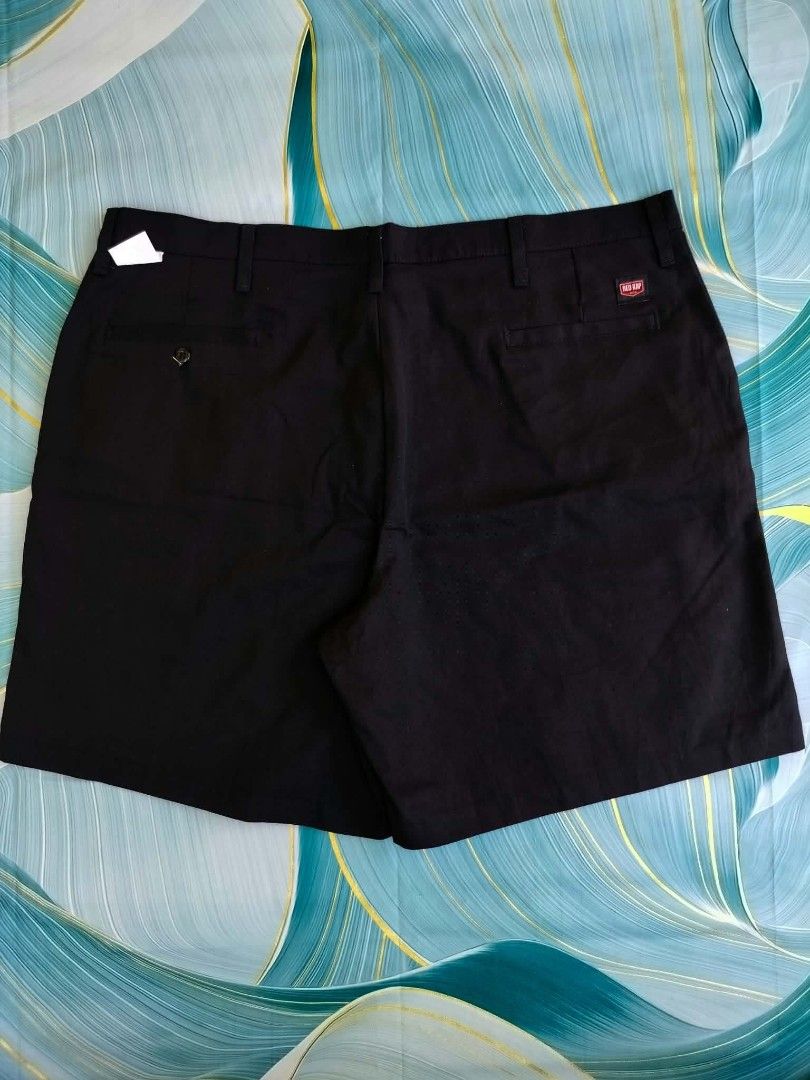 Red Kap Black Work Shorts (Category: Shorts) located in Manila. Submitted by virgiliosa38485 (Listing ID 1465507197, Image 1). Description: - Brand: Red Kap - Color: Black -Size 40 -Length 20 - Material: Durable cotton blend - Closure: Button closure with zip fly - Waistband: Features belt loops - Pockets: Two front slash pockets and two back welt pockets (one with button closure) - Details: Red Kap brand patch on the right back pocket and orange