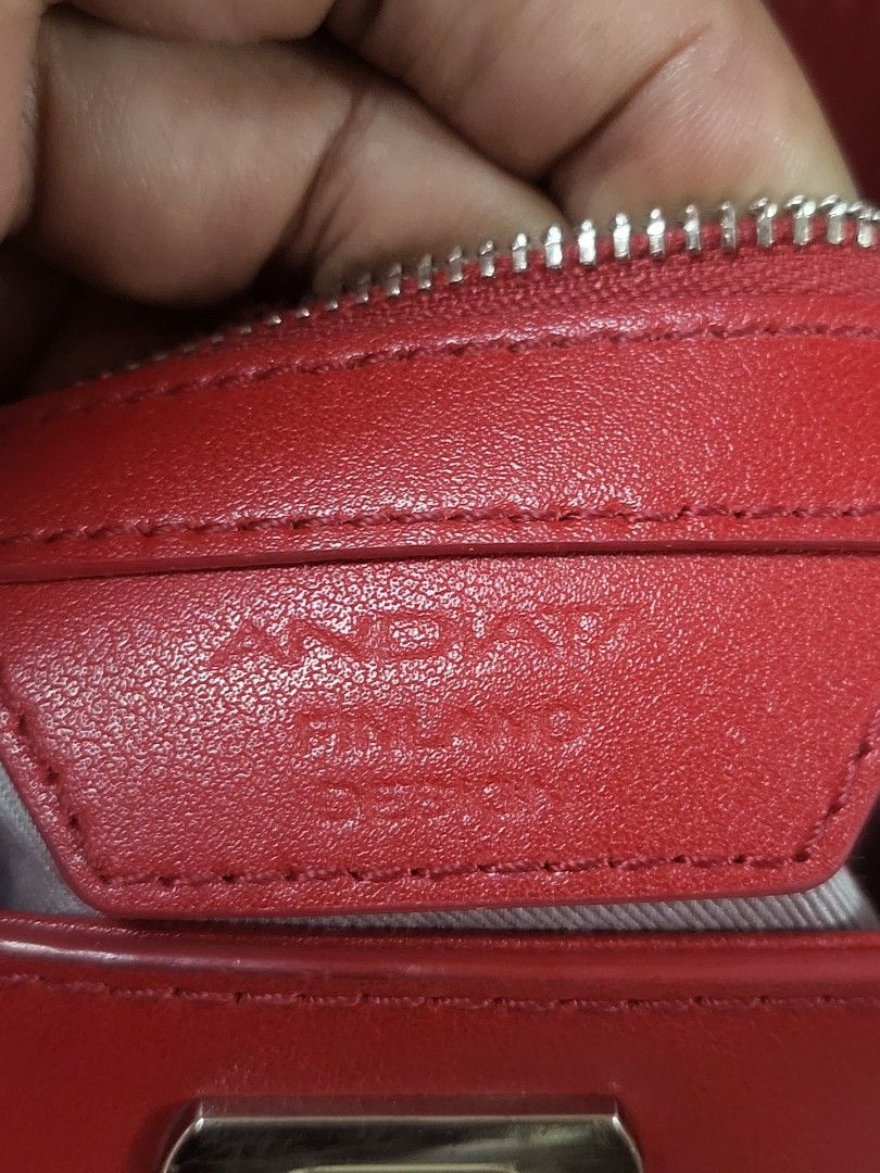 Red Leather Shoulder Bag with Silver Chain (Category: Shoulder Bags) located in Manila. Submitted by milkymitch23 (Listing ID 1465401804, Image 3). Description: - Color: Bright red - Material: Premium leather with silver chain straps - Closure: Flap front with turn-lock - Interior: Clean grey fabric lining with 1 zipped pocket - Exterior/Extra: Additional slip pocket under the front flap - Condition: Clean inside and out, ready to use.