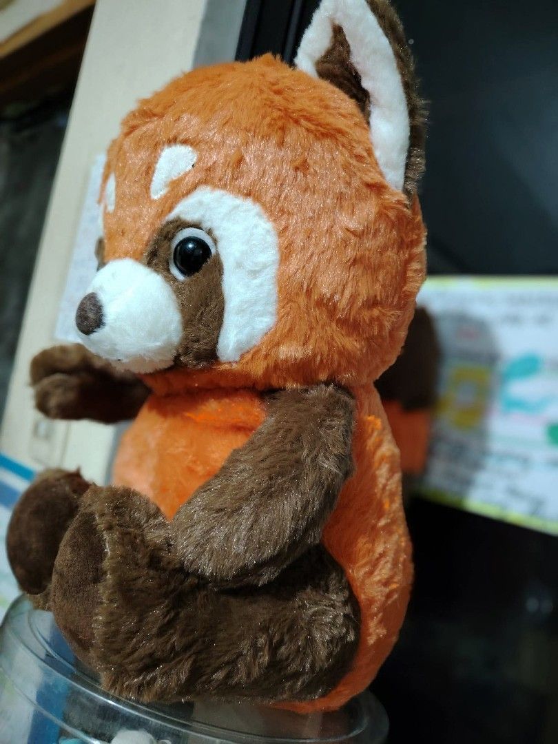 Red Panda Plush Toy Stuffed Animal (Category: Plushies & Soft Toys) located in Manila. Submitted by justybelieve2026 (Listing ID 1465499473, Image 2). Description: - Adorable red panda plush toy in a sitting posture - Ultra-soft orange and brown fur with cute white facial details - Features big dark eyes and a stitched nose - Clean and very well-kept stuffed animal - Ideal gift or addition to your plushie collection.