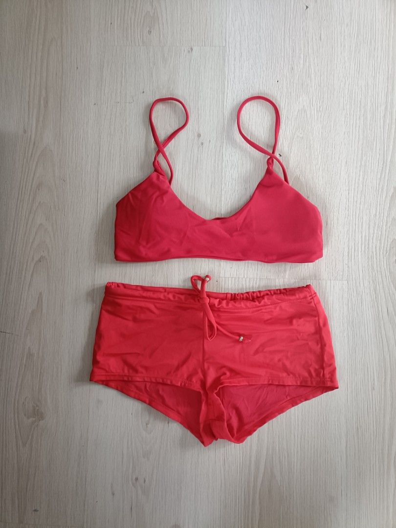 Red Two-Piece Bikini Set Swimwear (Category: Bikinis & Swimsuits) located in Bacoor. Submitted by Miss_Chuch0521 (Listing ID 1465424538, Image 1). Description: - Color: Bright red - Style: Two-piece bikini set - Top: Thin straps with a stylish inverted v-cut hem - Bottoms: Drawstring front detailed with metallic beads - Fit: Standard sizing with comfortable, stretchy fabric - Ideal for: Beach days, vacations, and pool parties.