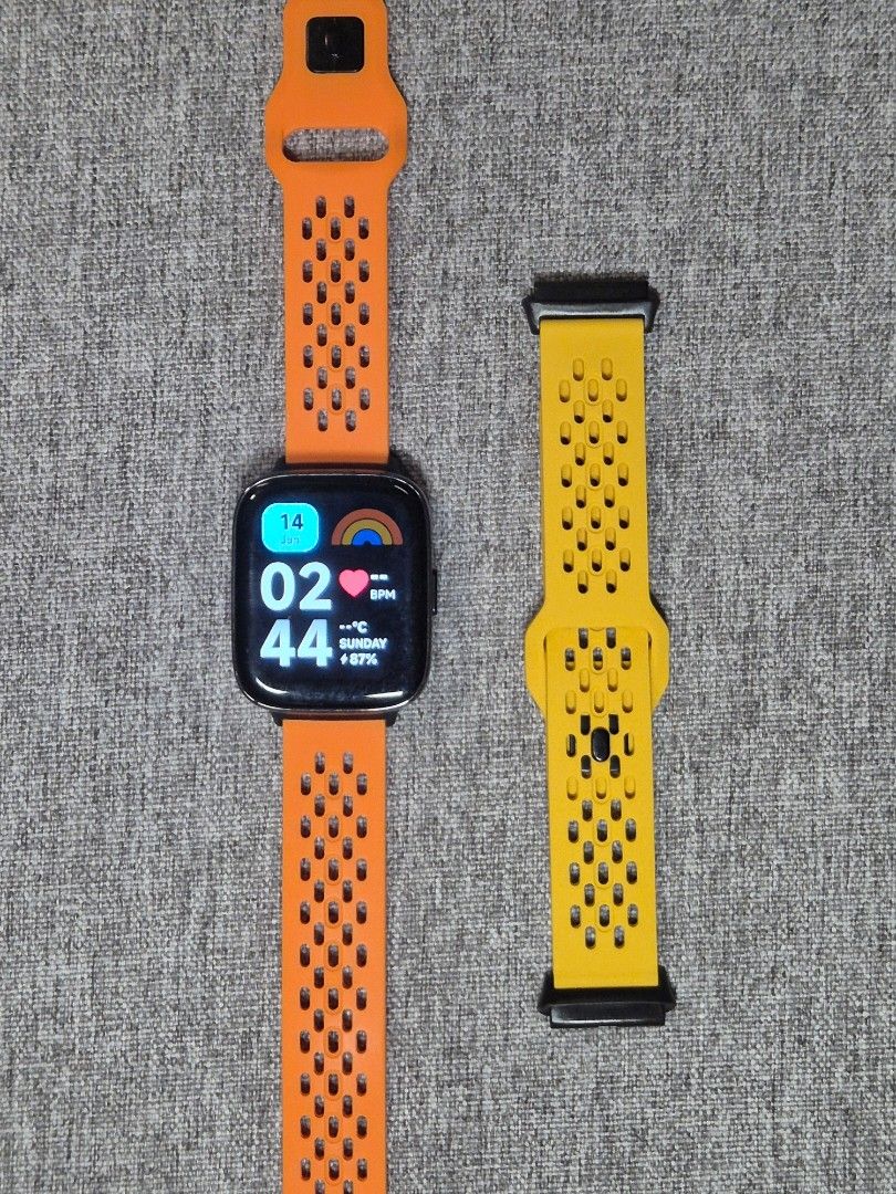 Redmi Watch 3 Active (Category: Wearables & Smart Watches) located in Paranaque City. Submitted by erinnnm (Listing ID 1465533639, Image 1). Description: - Brand/Model: Xiaomi Redmi Watch 3 Active (Model: M2235W1) - Condition: Working condition, lightly-used - Straps: Includes breathable sport-style orange strap attached plus an extra yellow strap (not original Redmi strap) - Display: Clear square touchscreen, no scratches, no dead pixels.