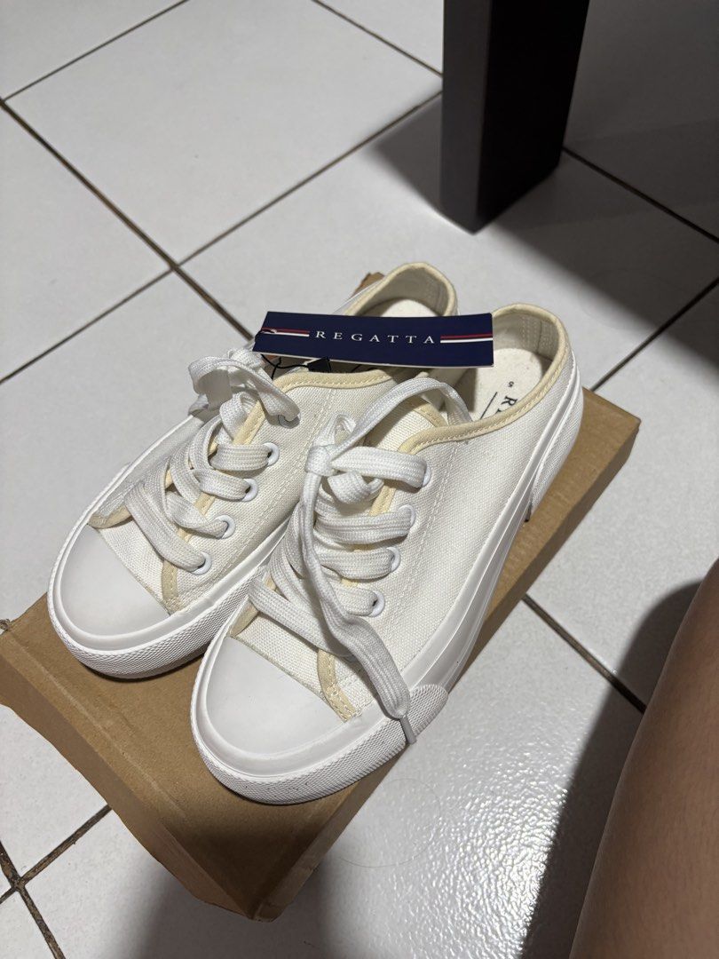Regatta White Canvas Slip-on Sneakers (Category: Sneakers) located in Calamba. Submitted by rafabariso (Listing ID 1465496483, Image 3). Description: - Brand: Regatta - Style: Low-back mule canvas slip-ons with front laces - Size: 5 - Condition: Brand new with tags (BNWT), never worn - Color: Clean white - Features: Versatile everyday footwear that matches any outfit - Reason for selling: Decluttering extra pairs.