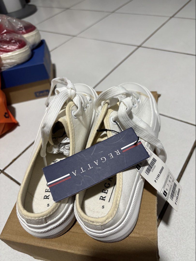 Regatta White Canvas Slip-on Sneakers (Category: Sneakers) located in Calamba. Submitted by rafabariso (Listing ID 1465496483, Image 2). Description: - Brand: Regatta - Style: Low-back mule canvas slip-ons with front laces - Size: 5 - Condition: Brand new with tags (BNWT), never worn - Color: Clean white - Features: Versatile everyday footwear that matches any outfit - Reason for selling: Decluttering extra pairs.