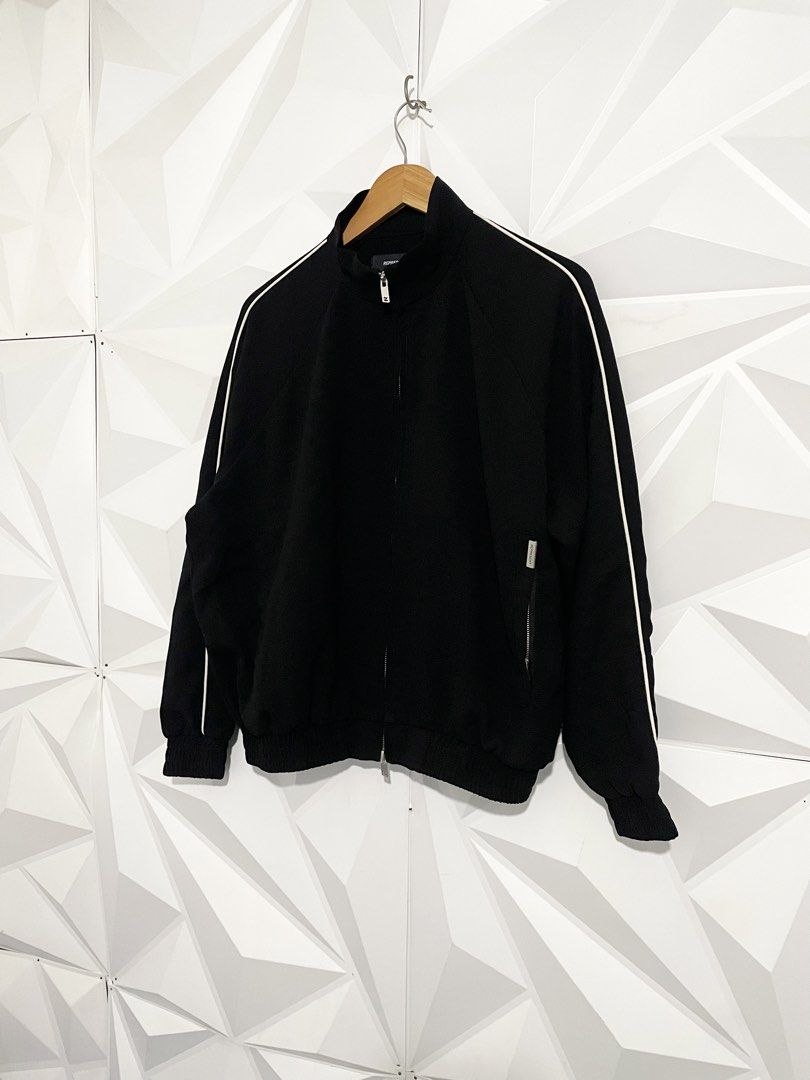 Represent Black Track Jacket with White Piping Size XL (Category: Coats, Jackets and Outerwear) located in Cabuyao City. Submitted by ParadisethriftedPh (Listing ID 1465463608, Image 2). Description: Cr: 9.8/10 Dimensions W: 24.5 L: 25 - Color: Classic black with white piping on sleeves - Size: XL on tag - Material: 100% premium cotton - Features: Full zip closure with custom 'R' hardware pulls, stand collar, ribbed cuffs and hem - Pockets: Conve