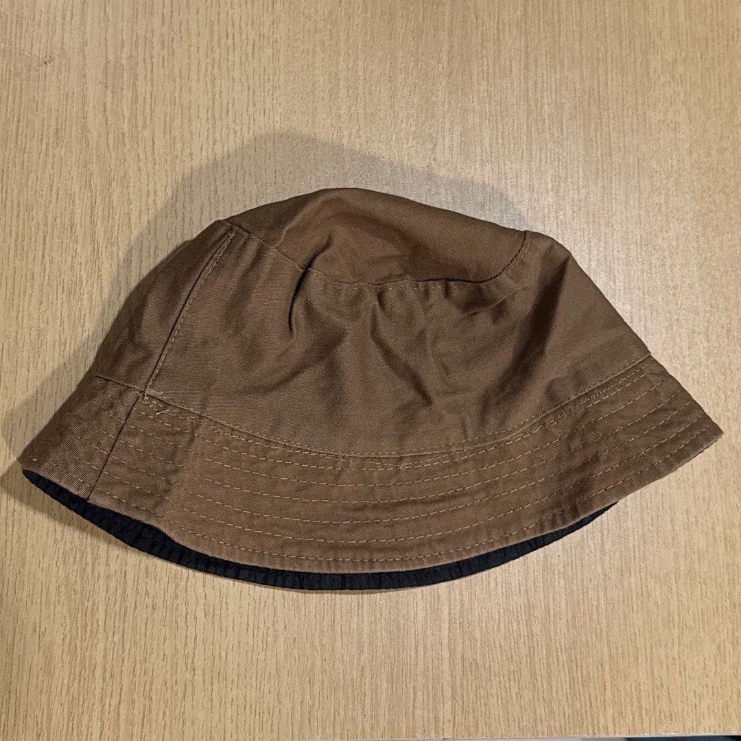 Reversible Brown and Black Bucket Hat (Category: Hats & Beanies) located in Makati City. Submitted by julyco. (Listing ID 1465443514, Image 1). Description: - 2-in-1 Reversible Design: Switch between solid brown and solid black - Travel-Friendly: Easy to fold and pack into any bag - Versatile Style: Great for outdoor trips, sunny days, and streetwear.