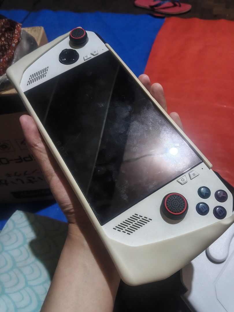 Rog Ally z1 Extreme (Category: Other Gadgets) located in Manila. Submitted by romeodelta85657 (Listing ID 1465506969, Image 1). Description: For sale Rog Ally z1 extreme, All stock, Memory slot not working, known issue siya ng mga rog ally, Mejo mababa battery health please see pics. Wala nang time magpalit. Yan lang ang issue Inclusion Skull and Co Pouch USB 3.0 Hub Box Original charger Case thumb Grip 2 pairs Tempered Glass Already installed Wi