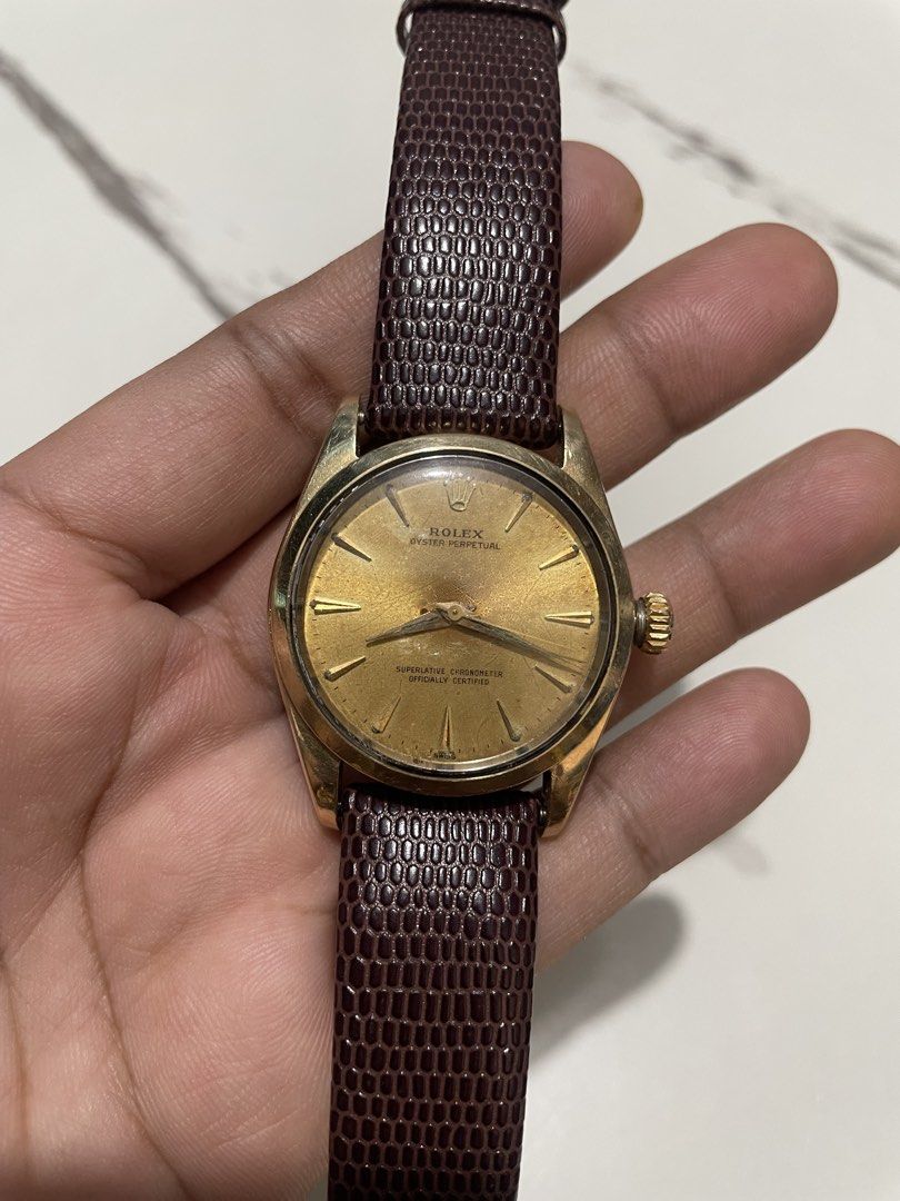 Rolex Oyster Perpetual (Category: Luxury Watches) located in Taguig. Submitted by j_watches007 (Listing ID 1465422971, Image 2). Description: Secondhand Used Watch Vintage Rolex Oyster Perpetual Swiss Made Automatic 1560 6634 Gold Tone Front Back Gold Tone Dial ( Patina, Gasgas ) Stainless Steel Back Case 34mm Replacement Leather, Buckle.