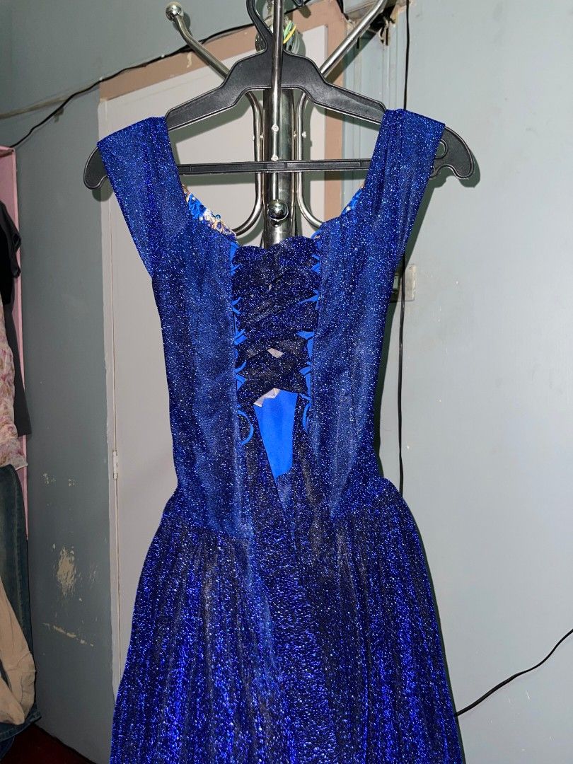 Royal Gown (FOR RENT) (Category: Evening dresses & gowns) located in Manila. Submitted by k_0ye (Listing ID 1465445526, Image 3). Description: - Color: Royal blue with a glitter finish - Design: Off-the-shoulder with a plunging V-cut and intricate blue & gold floral embroidery on the bodice - Fit: Adjustable lace-up corset back - Length: Floor-length flared skirt - Best for: Prom, formal parties, and evening galas.