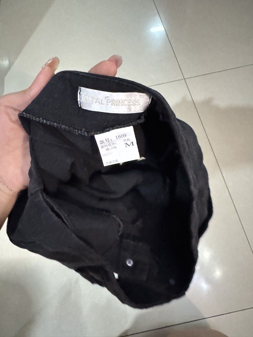 Royal Princess Black Skort (Category: Skirts) located in Quezon City. Submitted by sweetlyluxe (Listing ID 1465492882, Image 3). Description: - Brand: Royal Princess - Size: M - Color: Solid black - Design: Wrap front flap with single button closure, shorts underneath with skirt overlay - Style: Simple everyday piece.