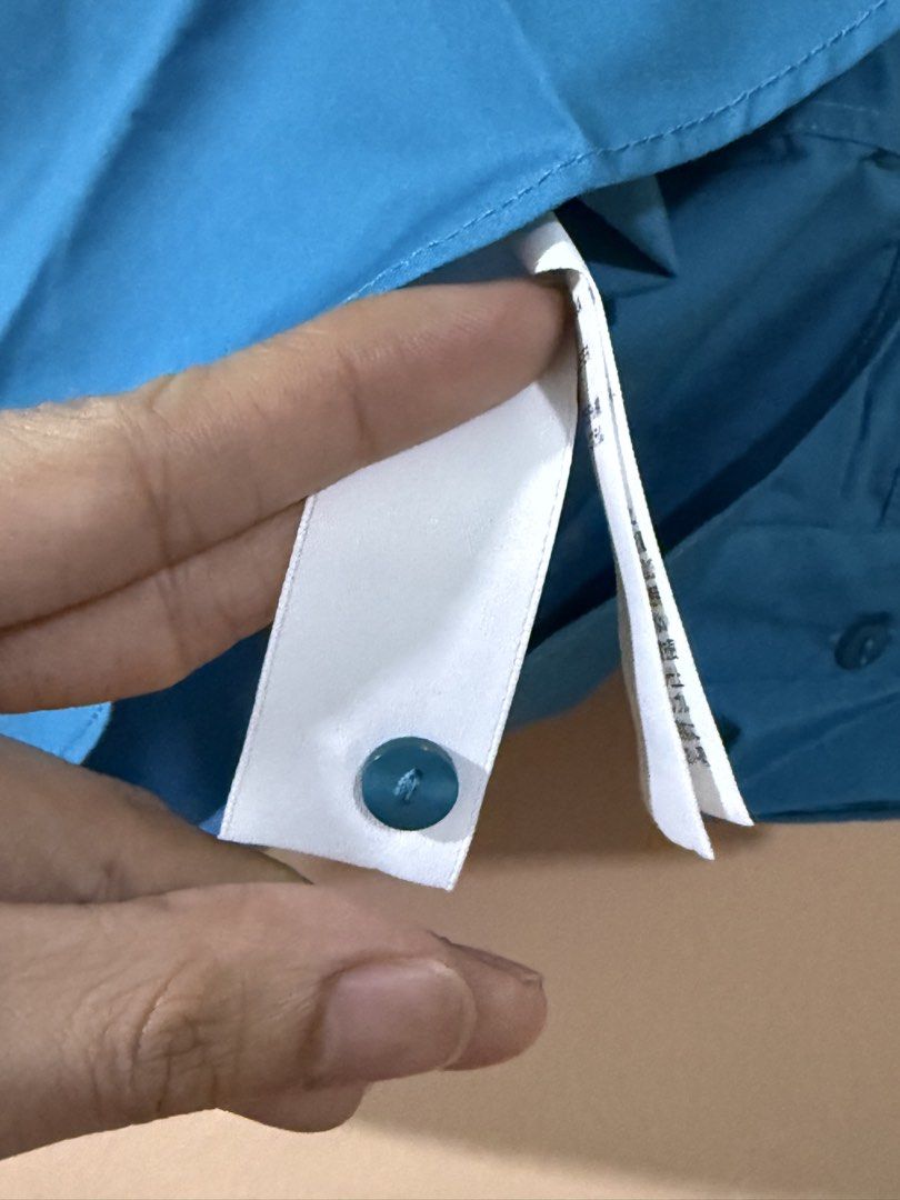 RuchedReady® Riley Relaxed Cotton Button Down Shirt (Category: Blouses) located in Manila. Submitted by castillopa17379 (Listing ID 1465515126, Image 3). Description: - Brand: Love Bonito - Style/Color: Teal - Size: S - Features: Right chest pocket, soft cotton and polyester blend - Condition: Brand new, still sealed in original plastic packaging with silica gel packet - Style Number: 11A5091067.