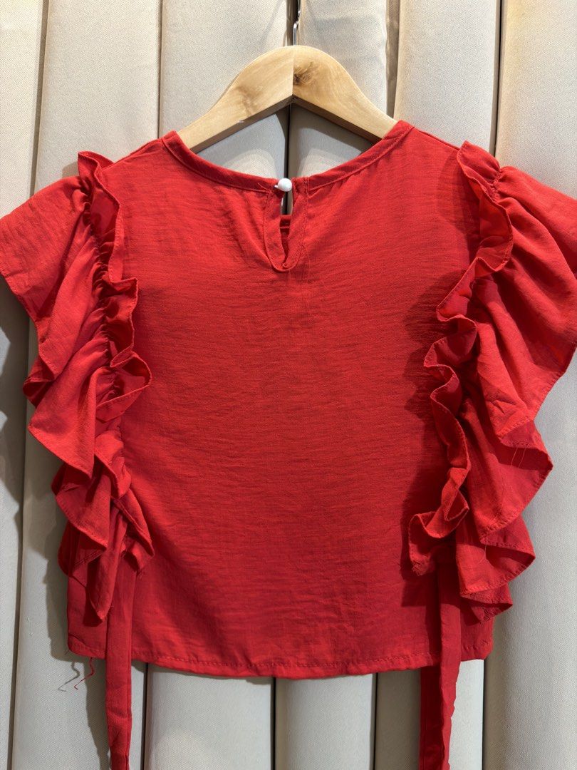 Ruffled Sleeve Blouse (Category: Sleeveless) located in Manila. Submitted by glamstylemnl (Listing ID 1465423274, Image 2). Description: ♡ SIZE: XS ♡ BUST: 30 ♡ Swipe left to see the actual color & details ♡ cascading ruffles / hanging sides ties ♡ HQ • 10/10 ♡ Ready to wear 👚.