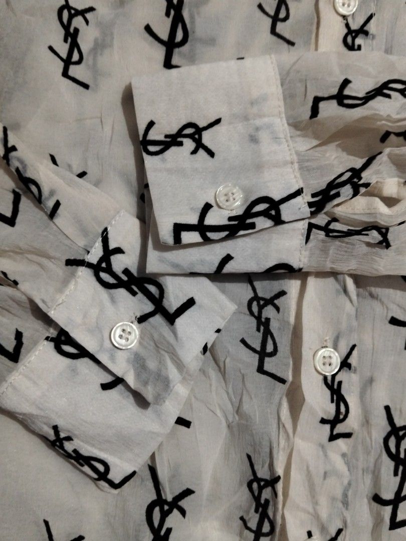 Saint Laurent Paris YSL Monogram Silk Shirt (Category: Luxury Apparel) located in Manila. Submitted by brarynpag30556 (Listing ID 1465571481, Image 3). Description: - Brand: Saint Laurent Paris - Color: Cream with allover black YSL monogram print - Details: Long sleeves with button cuffs, front chest pocket, classic collar - Origin: Made in Italy - Product Code: UP53 2017 00137 T9P2 429373 Y2OO1 1015 - Condition: Excellent, guaranteed authentic -