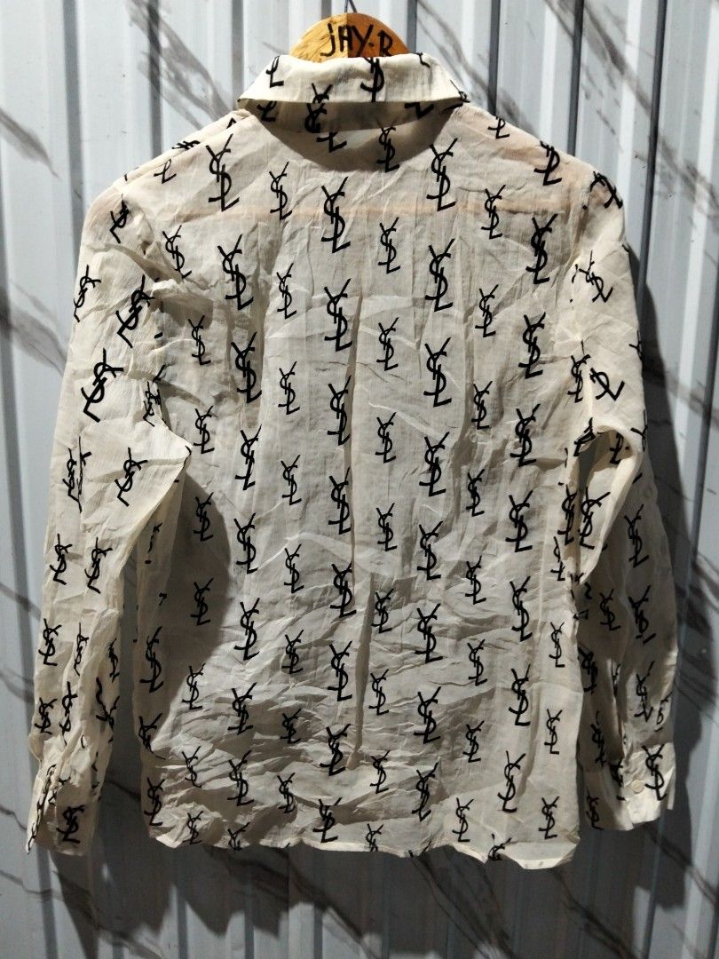 Saint Laurent Paris YSL Monogram Silk Shirt (Category: Luxury Apparel) located in Manila. Submitted by brarynpag30556 (Listing ID 1465571481, Image 2). Description: - Brand: Saint Laurent Paris - Color: Cream with allover black YSL monogram print - Details: Long sleeves with button cuffs, front chest pocket, classic collar - Origin: Made in Italy - Product Code: UP53 2017 00137 T9P2 429373 Y2OO1 1015 - Condition: Excellent, guaranteed authentic -