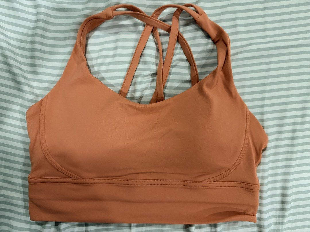 Salmon Sports Bra (Category: Activewear) located in Marikina City. Submitted by teacher.maria (Listing ID 1465391055, Image 1). Description: - Brand: Aura Athletica - Color: Warm orange - Size: Small - Design: Strappy cross-back for great support - Features: Built-in padding, soft and stretchy fabric - Condition: Clean, tags removed.