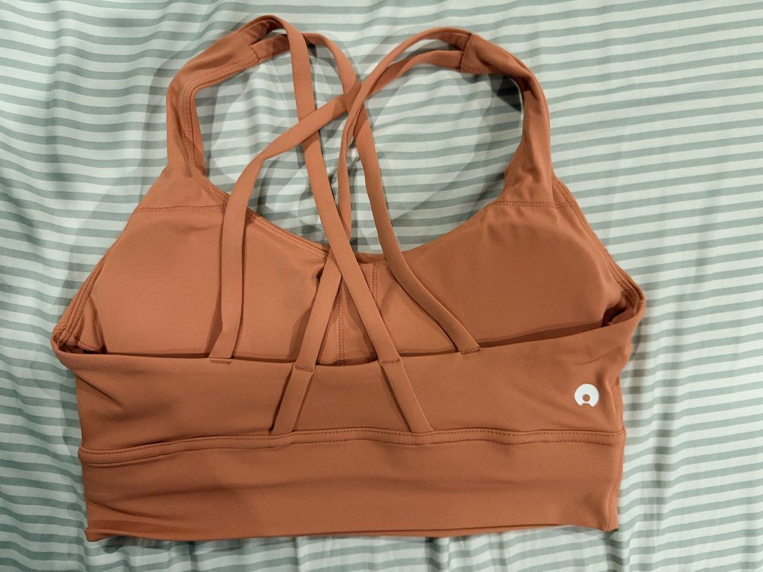 Salmon Sports Bra (Category: Activewear) located in Marikina City. Submitted by teacher.maria (Listing ID 1465391055, Image 2). Description: - Brand: Aura Athletica - Color: Warm orange - Size: Small - Design: Strappy cross-back for great support - Features: Built-in padding, soft and stretchy fabric - Condition: Clean, tags removed.