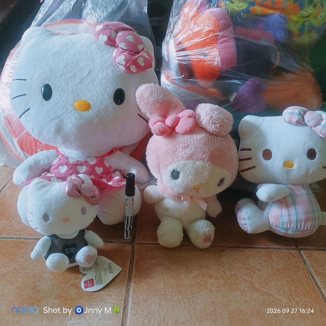 Sanrio Hello Kitty and My Melody Plush Toy Bundle (Category: Plushies & Soft Toys) located in Taguig. Submitted by mhayestufftoys (Listing ID 1465436555, Image 1). Description: - Set of 4 authentic Sanrio plush toys - Includes 3 Kitties and 1 My Melody - Large Kitty: Wears a cute pink dress with white hearts - Medium My Melody: Features a pink hood with a matching bow - Smaller Kitty: Styled in a charming checkered outfit - Smallest Kitty: Edgy b