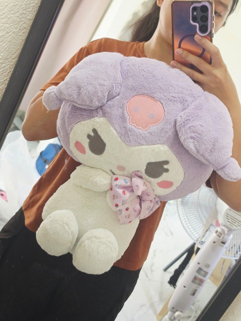 Sanrio Kuromi Plush Toy Huggable (Category: Plushies & Soft Toys) located in Bacolod City. Submitted by shop_with_mi (Listing ID 1465438396, Image 2). Description: P650 to P850 each - Item: Sanrio Kuromi Plush Toy - Condition: Clean, well-maintained, from a smoke-free space - Design: Sitting pose, white body, black hood, pink skull on forehead, and pink collar accents - Material: Soft, fluffy, and huggable - Perfect for: Sanrio collectors and fan