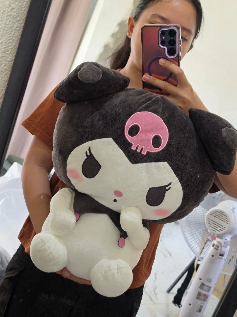 Sanrio Kuromi Plush Toy Huggable (Category: Plushies & Soft Toys) located in Bacolod City. Submitted by shop_with_mi (Listing ID 1465438396, Image 3). Description: P650 to P850 each - Item: Sanrio Kuromi Plush Toy - Condition: Clean, well-maintained, from a smoke-free space - Design: Sitting pose, white body, black hood, pink skull on forehead, and pink collar accents - Material: Soft, fluffy, and huggable - Perfect for: Sanrio collectors and fan