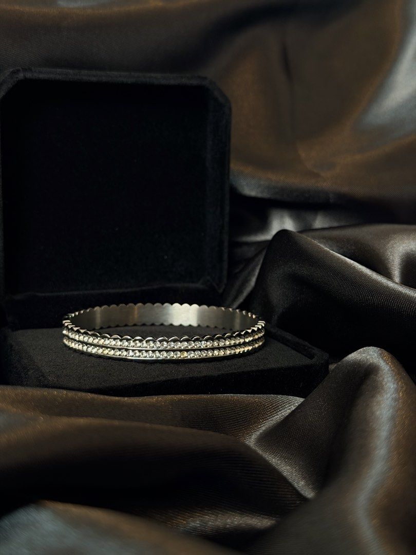 Scalloped Bangle Stainless Steel (Category: Jewelry) located in Manila. Submitted by frost.collections (Listing ID 1465430584, Image 1). Description: The Scalloped Bangle from the Icy Collection featuring crystal detailing in durable stainless steel. designed to add texture and shine to your wrist. .
