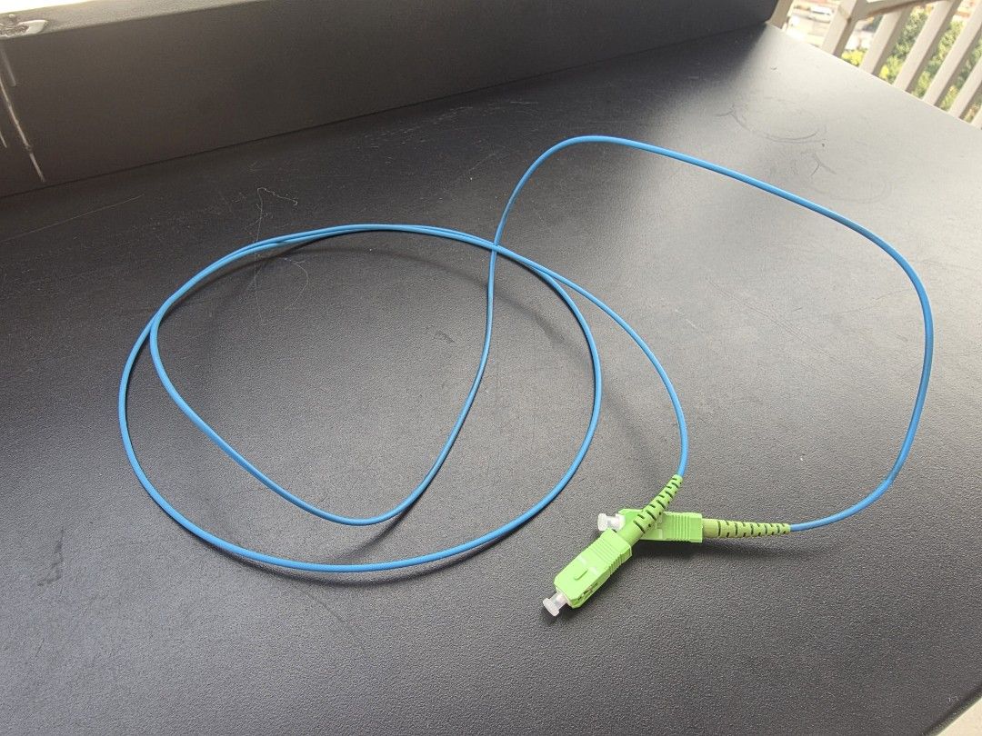 SC/APC to SC/APC Fiber Optic Patch Cable Blue (Category: Cables & Adaptors) located in Manila. Submitted by sound.solution (Listing ID 1465424362, Image 1). Description: - Type: Single-mode fiber optic patch cable - Connectors: Green SC/APC on both ends - Condition: Clean, no kinks or damage, plug and play - Extras: Protective white caps included - Ideal for: Network setups and internet routers 1.5meters.