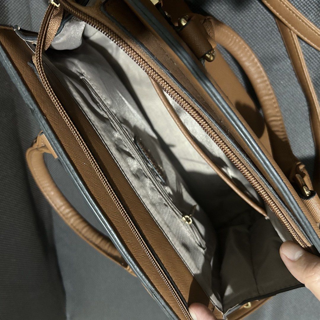 Secosana Molly Handbag Collection Brown (Category: Shoulder Bags) located in Dasmarinas. Submitted by lunabobbie (Listing ID 1465476713, Image 2). Description: - Brand/Model: Secosana Molly Handbag - Color: Brown with elegant gold-tone hardware - Versatile Carry: Includes top handles and an adjustable crossbody strap - Interior Organization: Center zip compartment, side slip pockets, and a zippered wall pocket - Protection: Metal feet on the bott