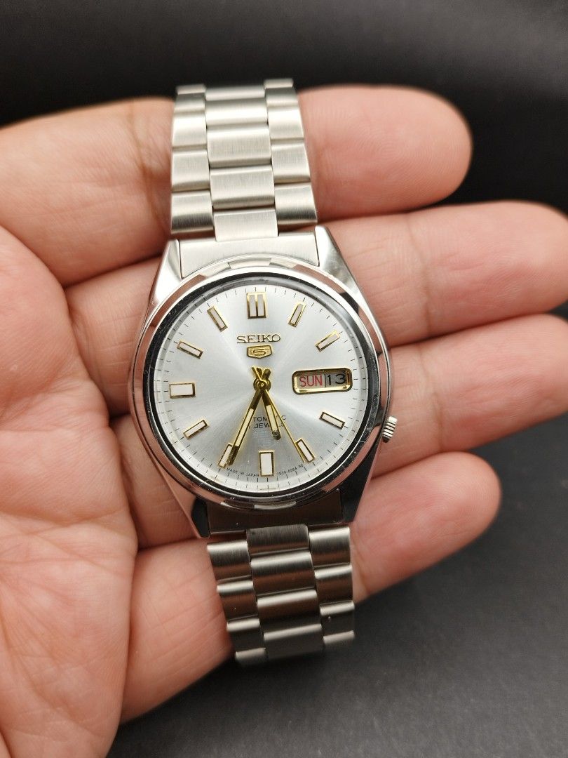 Seiko 5 automatic silver dial (Category: Men's Watches) located in Quezon City. Submitted by ars_watches (Listing ID 1465405274, Image 2). Description: original Seiko 7009 movement bnew aftermarket stainless steel base dial hands and strap in good running condition newly overhauled and oiled movement 37mm case dm with box and paper bag.